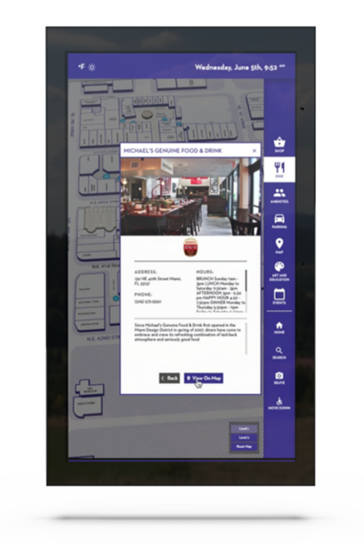 A large digital display with an interactive map and a dashboard with options
