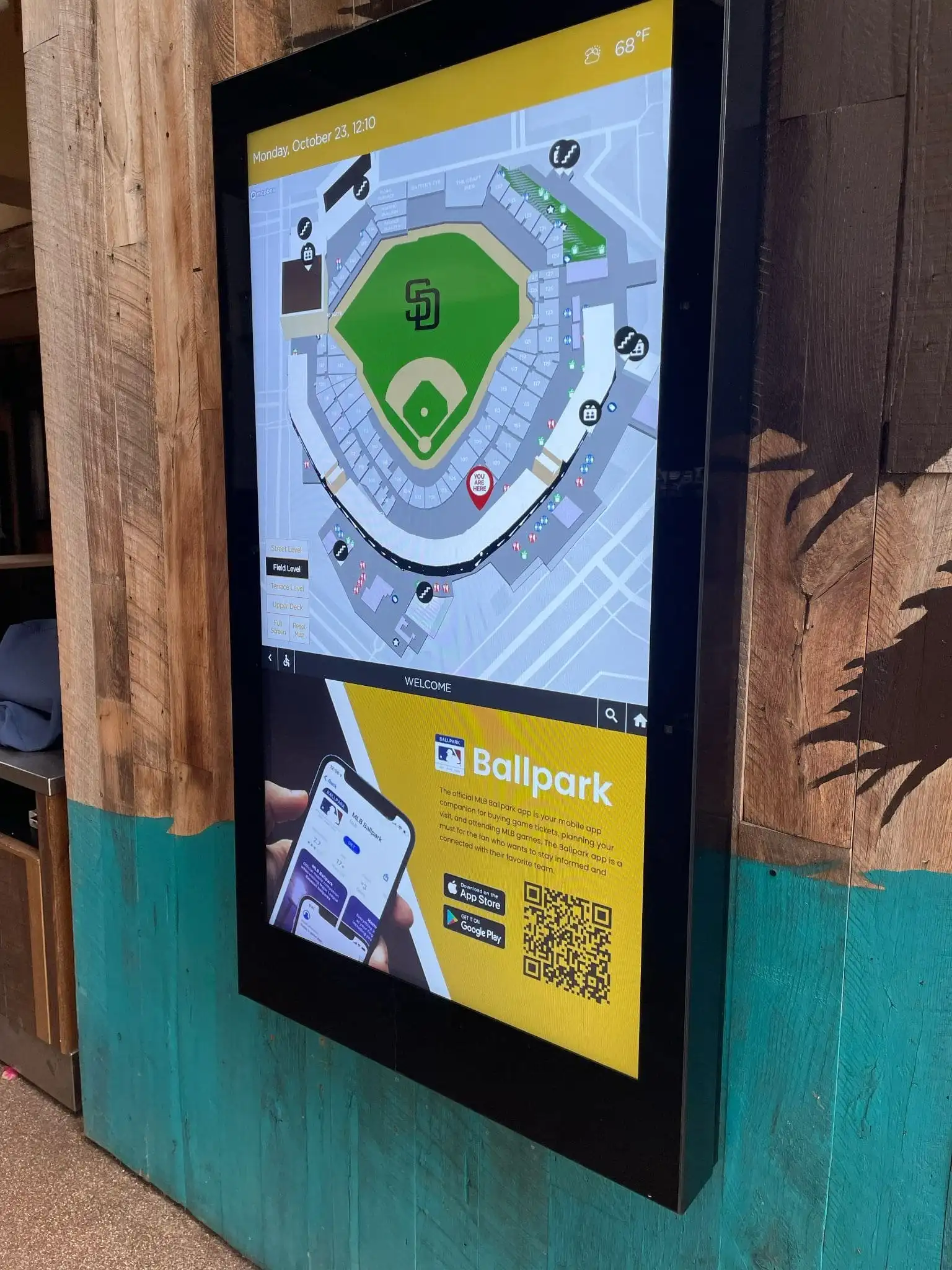 Wall mounted digital signage at the Padres stadium with a map of the park