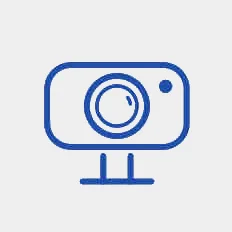 A blue line icon illustration on white of a digital camera