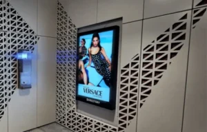 A digital display on the side of a wall with a geometric design